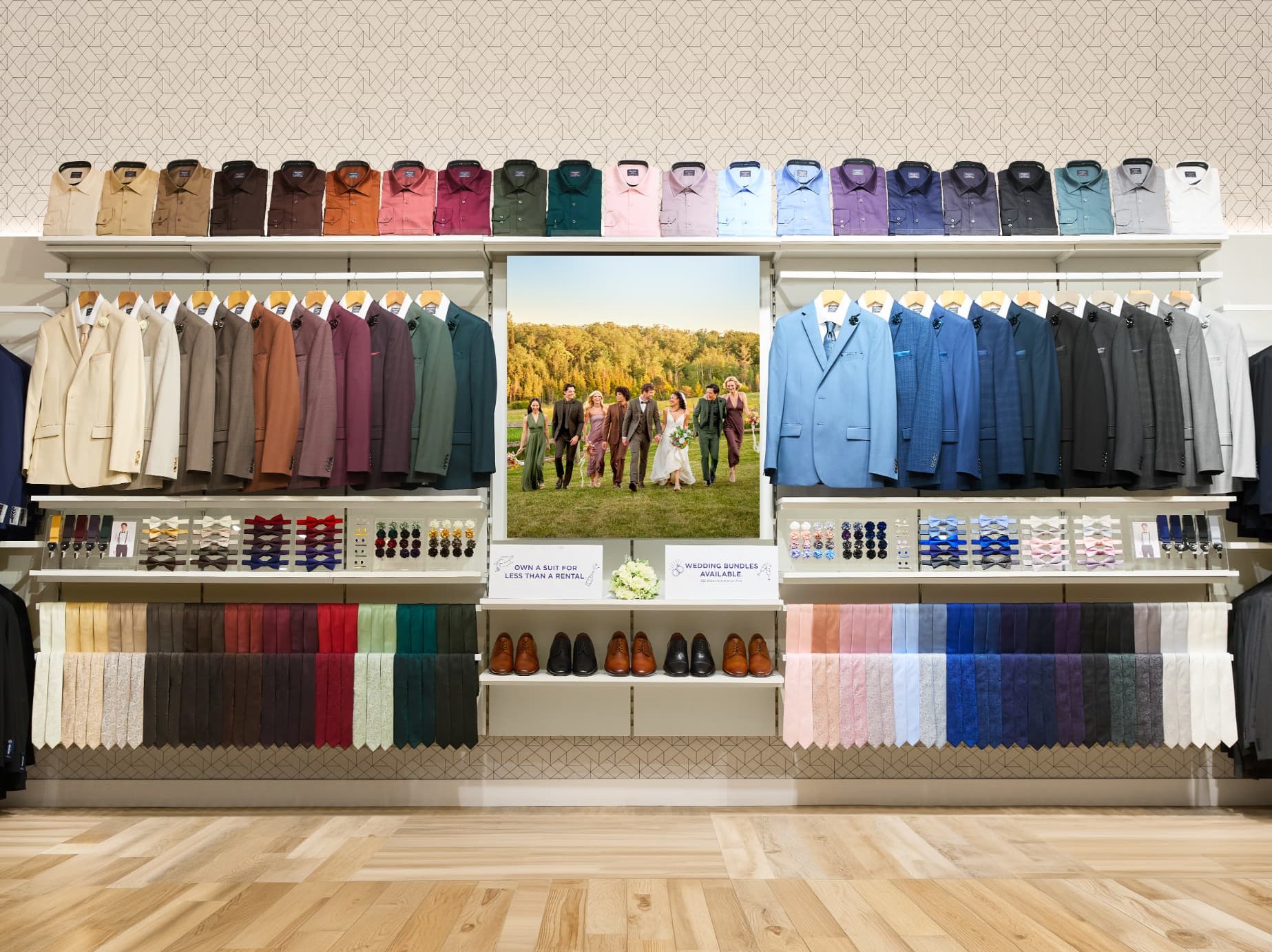 Tip Top event shop wall with colourful suits, shirts, ties and shoes